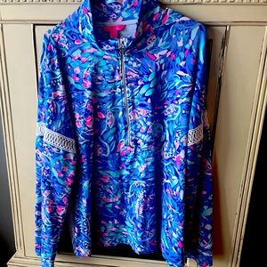 Lilly Pulitzer 1/2 zip with braided features on sides and arms. Like new.
